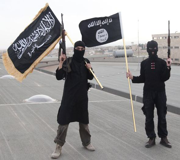 ISIS jihadists flying the black flag in Syria (Reuters)