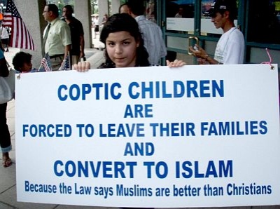 Coptic girl holding sign