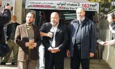 Hamas men in front of Jerusalem Red Cross compound