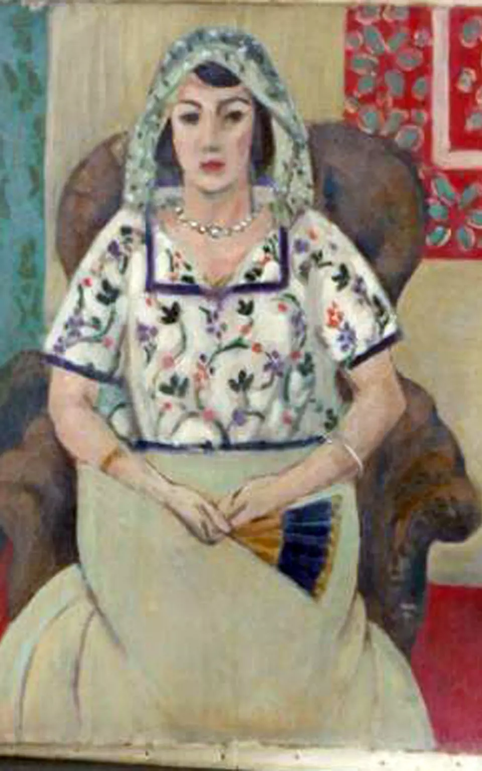  A Woman Sitting In A Chair
