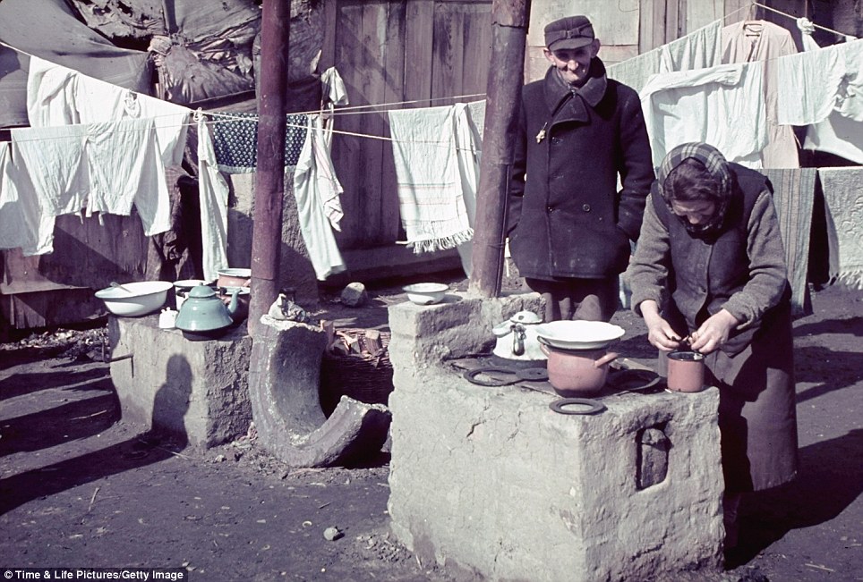 Woman Bending Over Stove